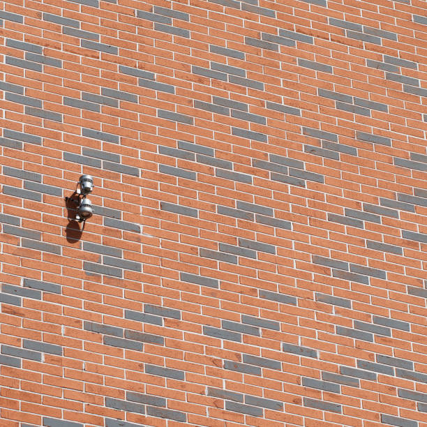 lantern lighting on the background of a brick wall on a sunny day