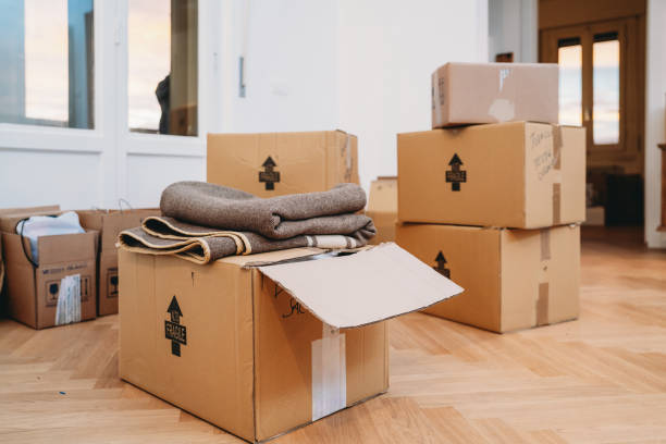 istock New apartment with many cardboard boxes during the relocation 1922335635