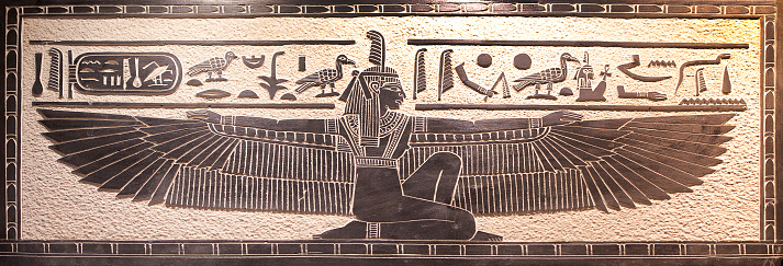 Egyptian hieroglyphic design of winged pharaoh, Luxor, Egypt. The River Nile has always and continues to be a lifeline for Egypt. Trade, communication, agriculture, water and now tourism provide the essential ingredients of life - from the Upper Nile and its cataracts, along its fertile banks to the Lower Nile and Delta. In many ways life has not changed for centuries, with transport often relying on the camel on land and felucca on the river