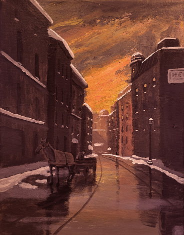 Morning breaks over a wintry street scene in an old town as a man prepares a horse cart.