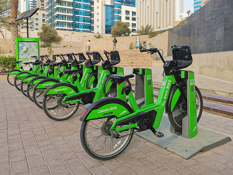 Parking of the city bike rental service in Dubai. Rental bikes are parked on the city promenade. Careem Bike service in the United Arab Emirates. Dubai, UAE - 09.23.2023