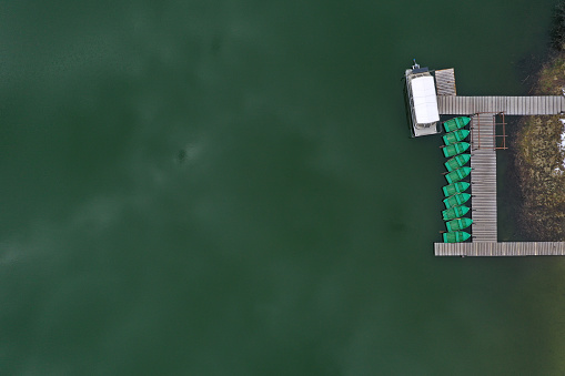 Aerial drone view of a lake boat dock. Flying above a vessel pier