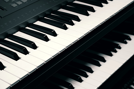 Digital piano keyboards close up