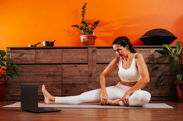 istock Woman doing yoga online at home. 1922382007