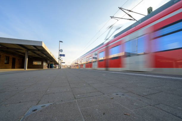 Kirchheim, Germany, January 10 2024: Deutsche Bahn train at the station - S-Bahn at track 2 towards Stuttgart. Red train during rail strike