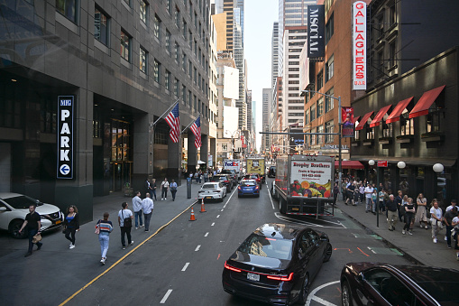 New York City, New York, USA, April 12, 2023 - Waiting theatergoers outside the Neil Simon Theatre (a Broadway theater in Midtown Manhattan in New York City).