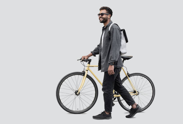 istock Handsome young man with bicycle, isolated 1922434753