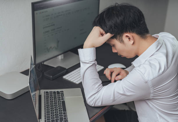 istock Young asian businessman using smartphones and computers. 1922442727
