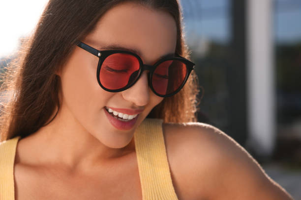istock Beautiful smiling woman in sunglasses outdoors on sunny day 1922451663