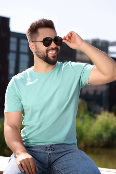 istock Handsome smiling man in sunglasses outdoors on sunny day 1922453351