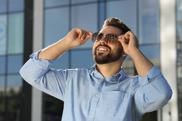 istock Handsome smiling man in sunglasses outdoors on sunny day 1922457068
