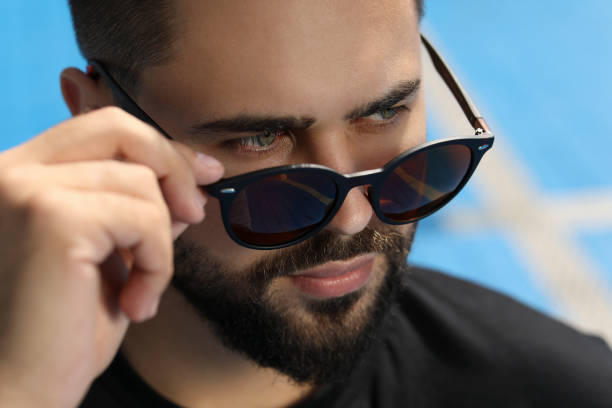 istock Handsome man in sunglasses outdoors on sunny day, closeup 1922463347