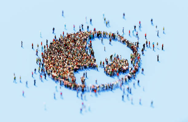 istock Human Crowd Forming World Symbol On Blue Background 1922464448