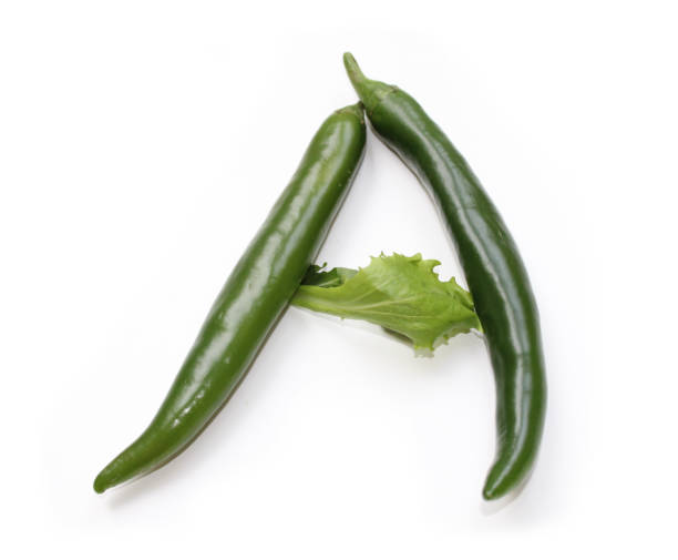 istock Letter A made from green chili peppers and salad alphabetic ABC letters 1922475407