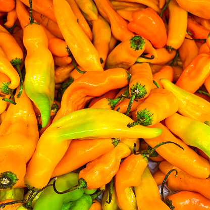 Close-up view of orange color chilly pepers for sale in a supermarket in Caracas city