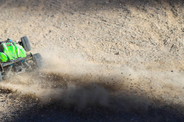 istock disassembled radio control car, on the sand skidding and control 1922476474
