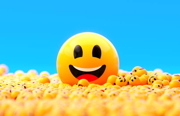 istock Yellow Spheres Textured With Happy Face Emoji On Blue Background 1922477016