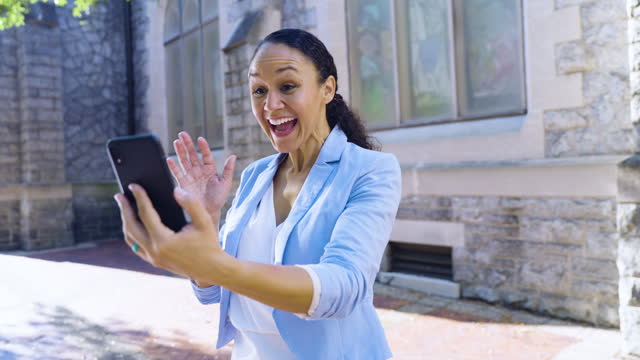 Multiracial woman excited to see someone on video call