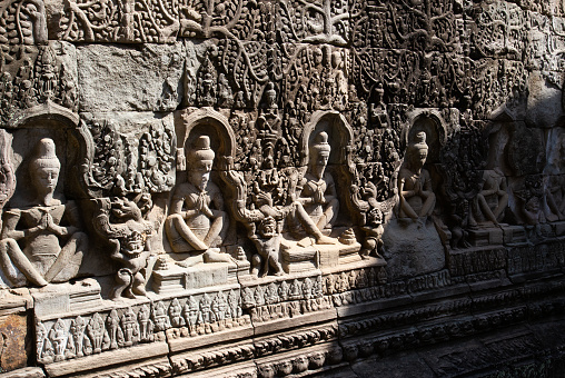 Ancient statues and carvings adorn the walls of Angkor Wat, one of the most popular tourist destinations in Southeast Asia. Angkor Wat, Cambodia