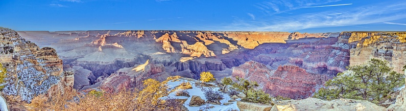 Panoramic image over the Grand Canyon from the South Rim during sunrise in winter
