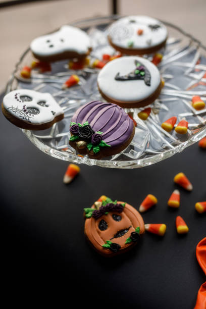 istock Candy corn and Halloween themed cookies served on a black background 1922517940