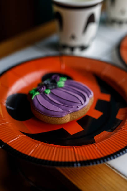 istock Halloween cookie served on a Jack o' lantern plate for a party 1922517956