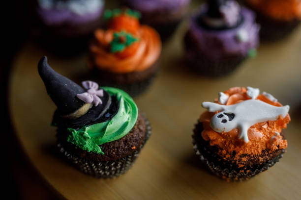 istock Cute Halloween themed cupcakes served on a wooden plate 1922518069