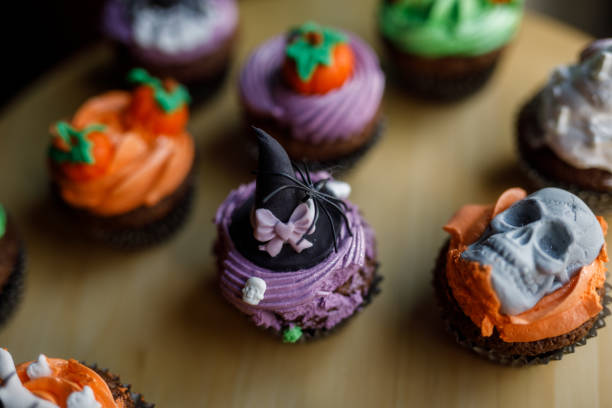 istock Cute Halloween themed cupcakes served on a wooden plate 1922518089
