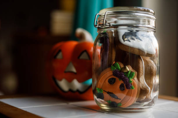 istock Cute Halloween themed cookies in a glass jar 1922518092