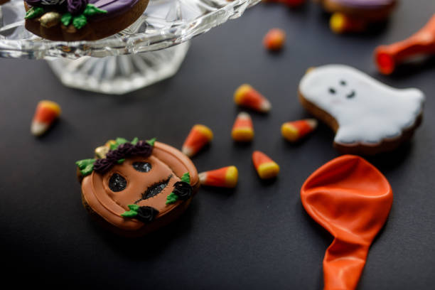 istock Candy corn and Halloween themed cookies served on a black background 1922518101