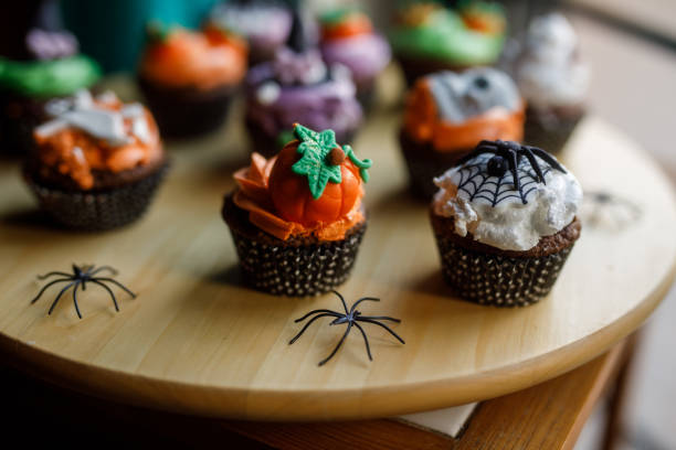 istock Cute Halloween themed cupcakes served on a wooden plate 1922518106