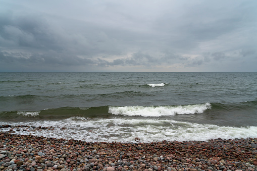 View of the Baltic Sea and a pebble beach on a cloudy summer day, Svetlogorsk, Kaliningrad region, Russia