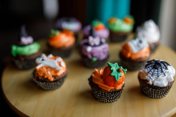 istock Cute Halloween themed cupcakes served on a wooden plate 1922519144