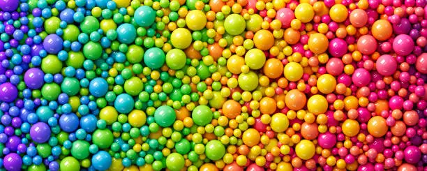 Vector illustration of Many rainbow glossy gradient random balls