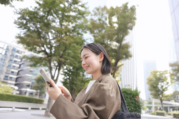 istock Asian woman using a smart phone 1922549064