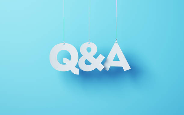 Q&A cut on white note paper hanging on string, White note paper blue background