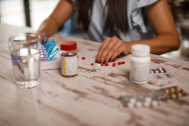 istock Young woman sorting out her prescription medication 1922571238