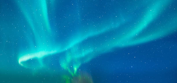 istock Northern lights or Aurora borealis in the sky over Tromso, Norway 1922583623