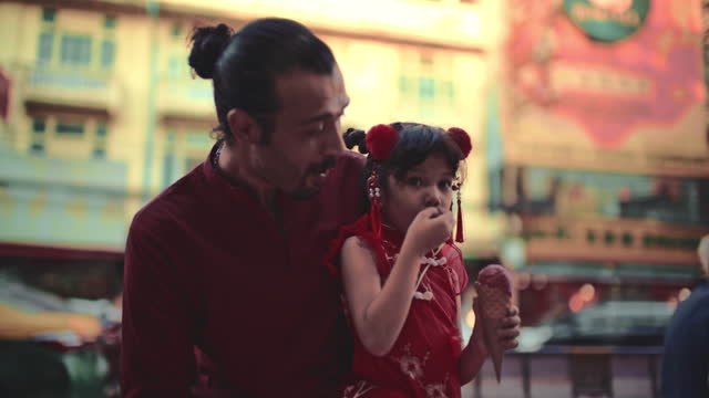 Father and daughter in Chinatown street