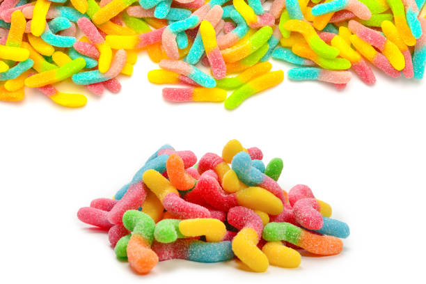 istock Frame of assorted gummy candies isolated on white. Top view. Space for text or design. 1922590610