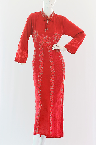 Red long dress with long sleeves, have a feminine pattern made from soft and cool satin.