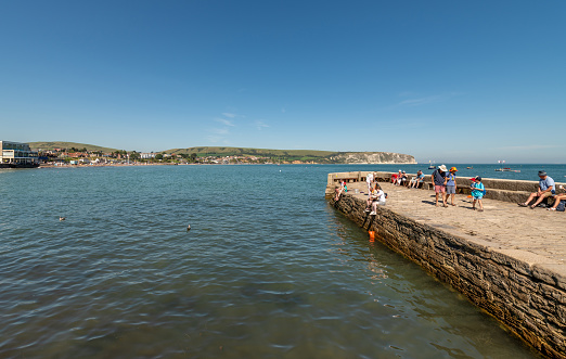 Swanage, UK. 4 September 2023. Tourists on The Stone Quay in Swanage, Dorset.