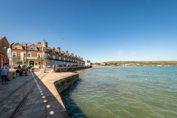 Swanage, UK. 4 September 2023. People walking on the promenade in Swanage