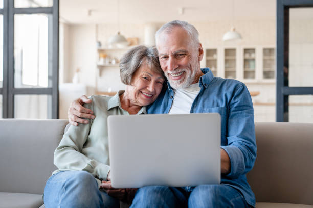 istock Caucasian couple hugging together while watching movie 1922610758