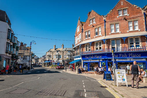 Swanage, UK. 4 September 2023. People walk around Shops and restaurants in Swanage, Dorset.