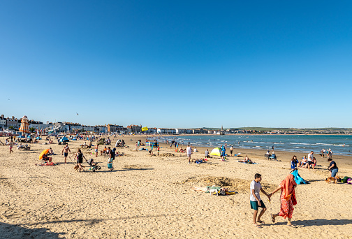 Weymouth, UK. 4 September 2023. People on the beach in Weymouth on a sunny day.