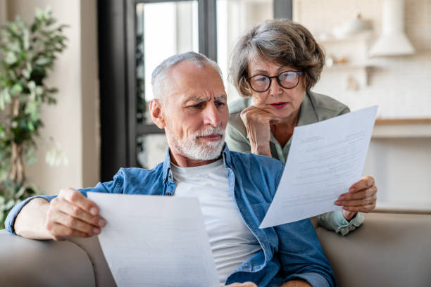 istock Senior grandparents reading documents, having issue problem debt with money loss 1922626134