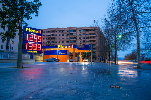 Valencia, Spain January 10, 2024. Plenoil low cost gas station displaying gas prices on a billboard.