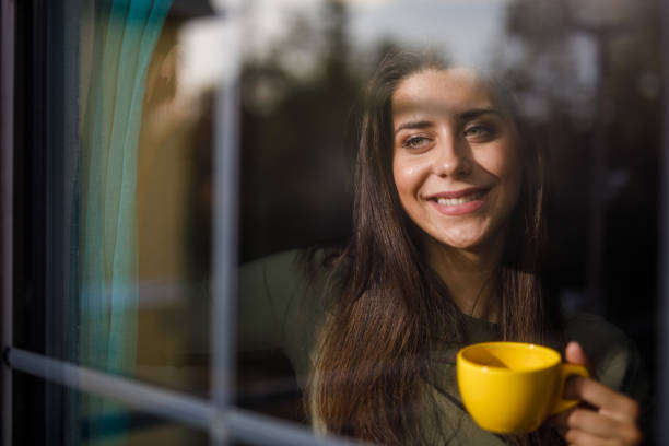 istock Enjoying a morning cup of coffee by the window 1922644295