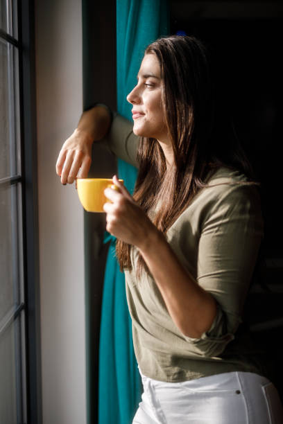 istock Enjoying a morning cup of coffee by the window 1922644302